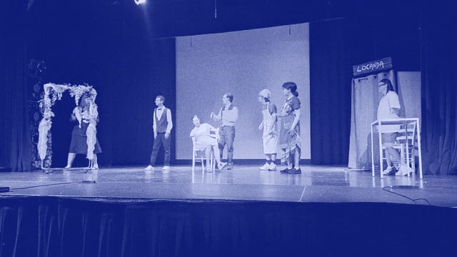 The stage of one of the academy's shows with the company lined up